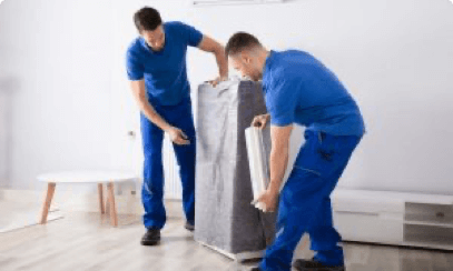 Two Movers from First Rate Movers wrapping furniture