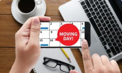 A smartphone calendar reads "moving day"